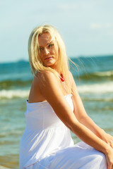 Fototapeta na wymiar Young lady on sunny beach.