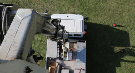 van with a ladder truck photographed from the aerial platform