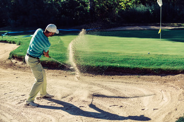 Golfer in sand trap