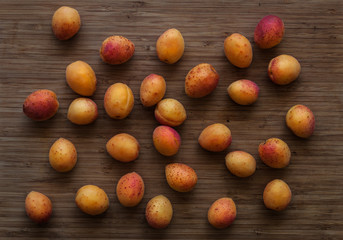 Apricots on the board background