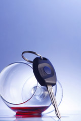 car key resting at wine glass