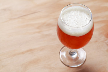 Glass of beer on wood