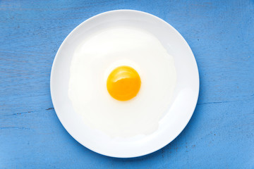 raw egg yolk on the dish on table