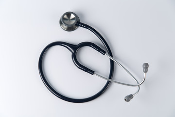 Stethoscope close up view. Stethoscope with reflection. Stethoscope background. Stethoscope with reflection on glossy background. - 129477958