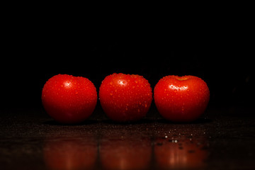 Fresh red tomatoes with water drops