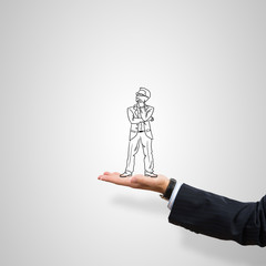 Caricatures of businessman in palm