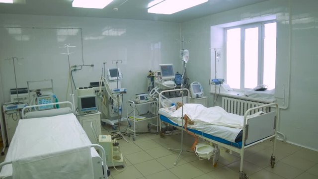 Patient in a bed in intensive care unit. 4K.
