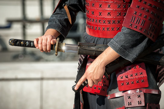 Samurai unsheathed his traditional katana