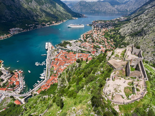 Ancient ruins of castle St. John (San Giovanni) are on top hill. Gulf of Kotor. View from drone....