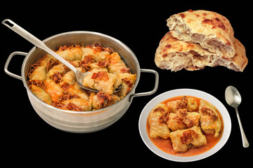 Sauce Pot And Plate Of Cabbage Rolls Stuffed With Minced Meat And Pitta Bread Isolated On Black Background