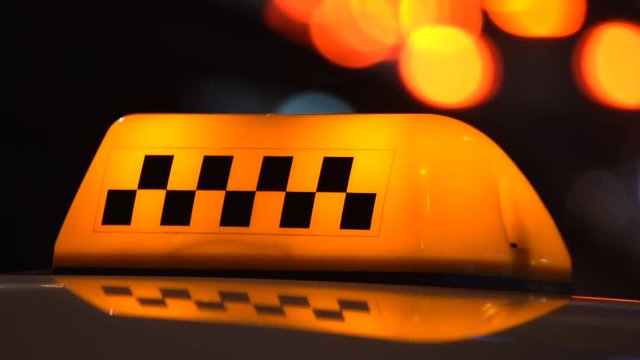 Taxi sign in traffic
