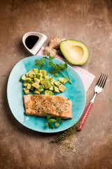 grilled salmon with sesame seed soy sauce and avocado salad