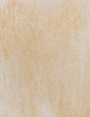 Wall painted with paint sea sand texture.