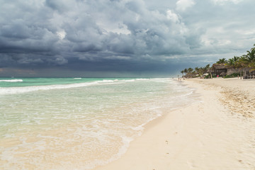 Fototapeta na wymiar Beautiful beach. Storm sky over the sea Tulum, Mexico, Carribean