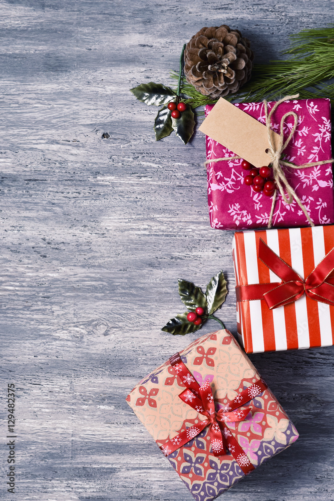 Poster christmas gifts on a wooden surface