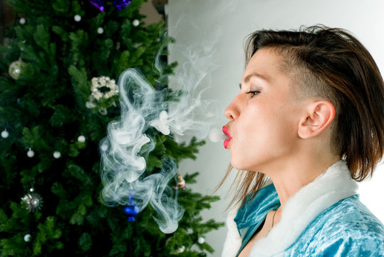 sexy woman smoking electronic cigarette, vape mod concept