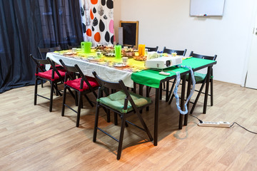 Table with cold snacks in room to celebrate a birthday or children party