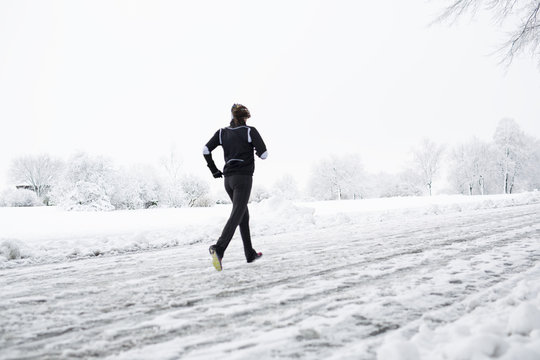 Person Runner Running In Winter Snow