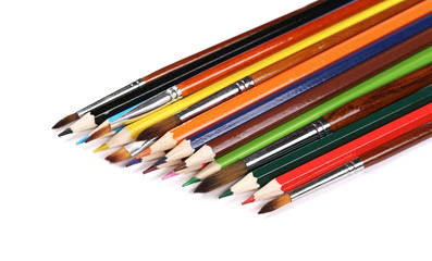 Fototapeta premium brushes painting and color pencils isolated on white