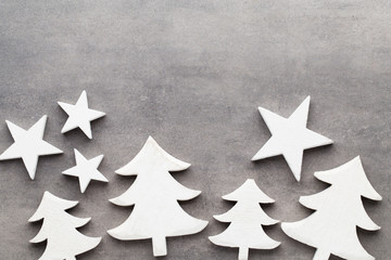 Christmas background. White tree decorations on a gray backgroun