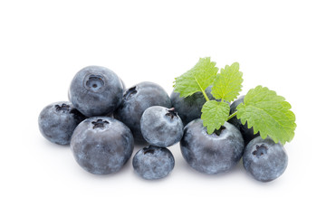 Close up of a blueberry branch isolated over white.
