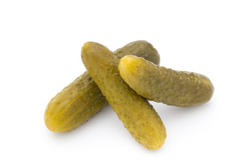 Marinated pickled cucumbers isolated on the white.