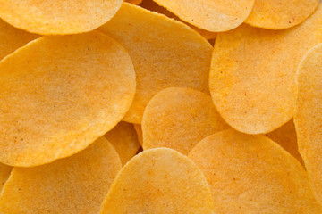 Close up potato chips on wood top view background.