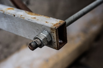 Rusty iron fixture with bolts