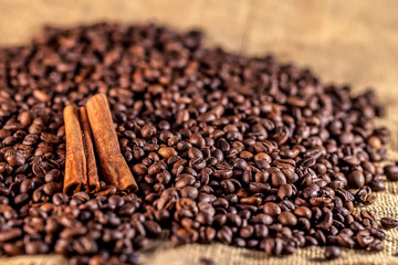 Coffee beans and cinnamon on sacking