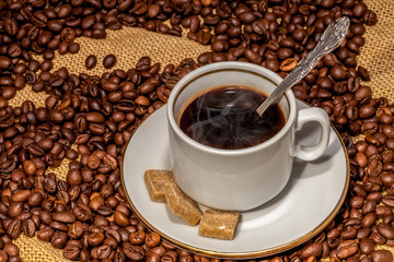 Coffee cup and sugar on a saucer
