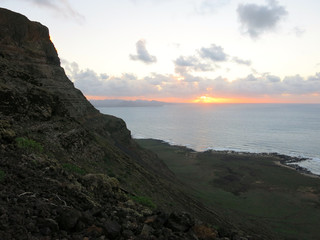 Sunset seen from the cliff. Lanzarote, Canary Islands, Spain.