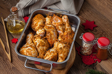 Marinated chicken drumsticks ready for baking.