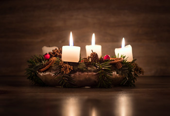 Advent wreath with three burning candles