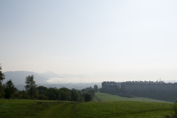 Fototapeta na wymiar Misty morning with the view on the fog over the city. Slovakia