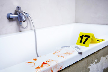 Traces of blood on place of crime (bathtub)