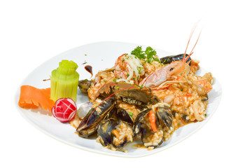 Italian risotto with shrimps, mussels, octopus, clams and tomatoes, seefood, with  background, 