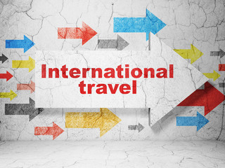 Travel concept: arrow with International Travel on grunge wall background