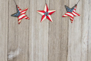 USA patriotic old flag on a stars and weathered wood background