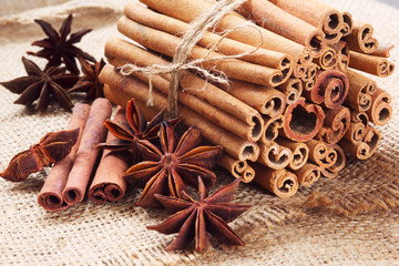 star anise and bunch of cinnamon on a sackcloth
