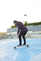 Portrait of young man on longboard