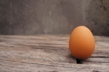 Brown eggs on a old wood table