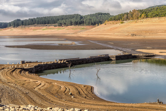 Reservoir low water levels reveal historic bridge submerged