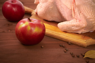 Fresh chicken on a wooden table