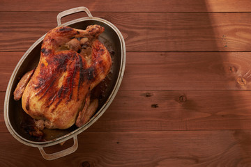 roasted bird on a wooden table