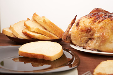 roasted bird on a wooden table