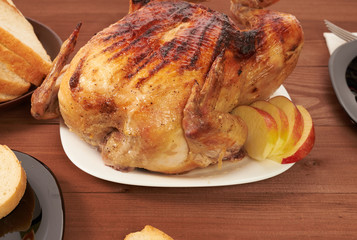 roasted bird on a wooden table