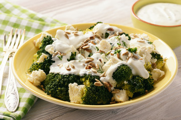 Broccoli salad with feta cheese, garlic dressing and sunflower seeds.