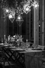 Decoration festive table before a banquet. Black and white.