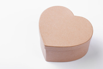 Beige heart shaped present box. Gift box isolated. Suprise in handmade present box. Happy Valentine`s day.