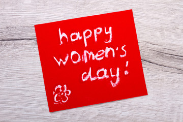 Fototapeta na wymiar Happy Women`s Day mockup card. Greeting card on wooden backdrop. Receive ideas for handmade. Make women happy.